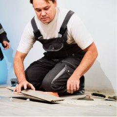 Contractor installing laminate floor